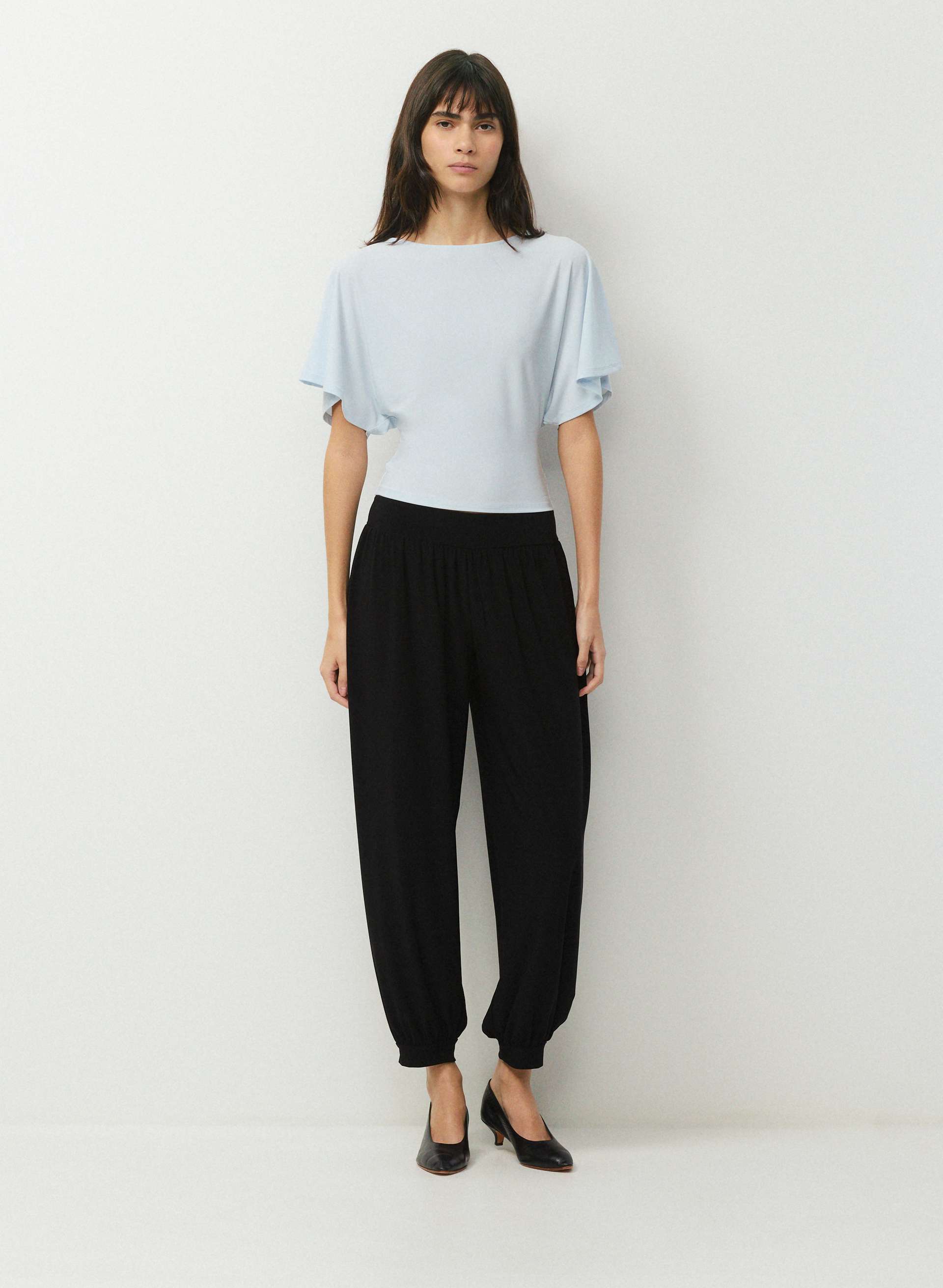 SMOOTH MATTER™ GINGER TOP - Unlined, semi-sheer drapey jersey boatneck top with tie detail. 