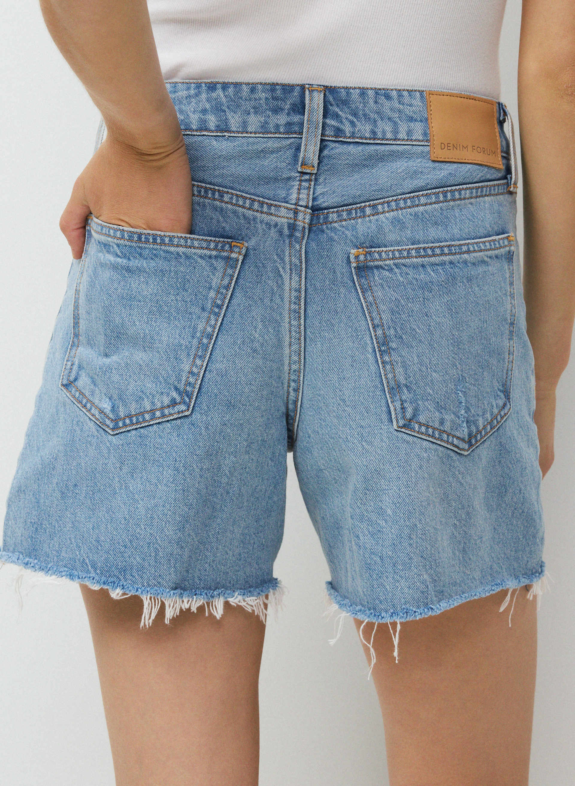 THE EX-BOYFRIEND HI MID-THIGH DENIM SHORT | Aritzia