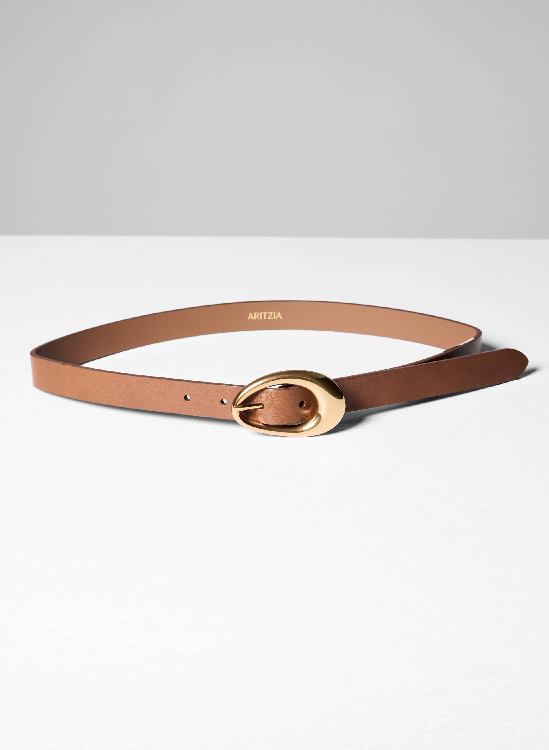 PERENNIAL SOLID BRASS LEATHER BELT | Aritzia