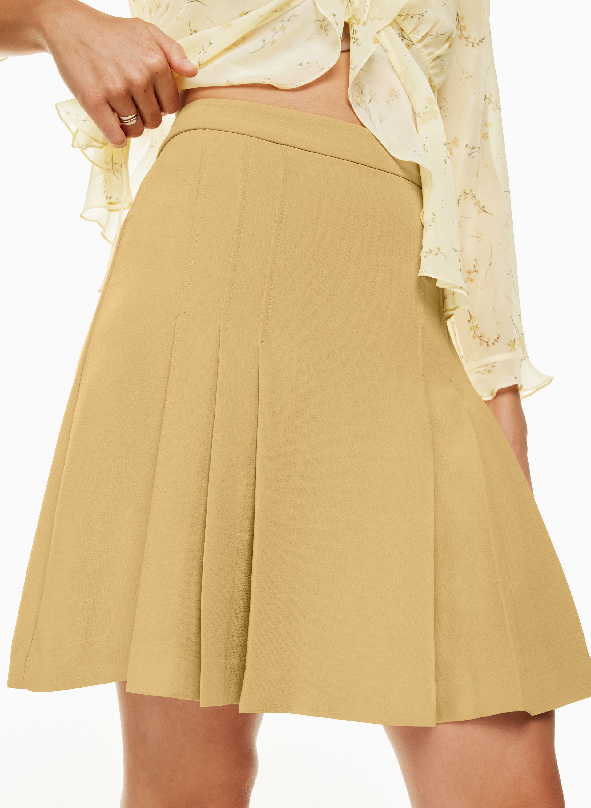 JUPE PLISSÉE TAPESTRY | Aritzia
